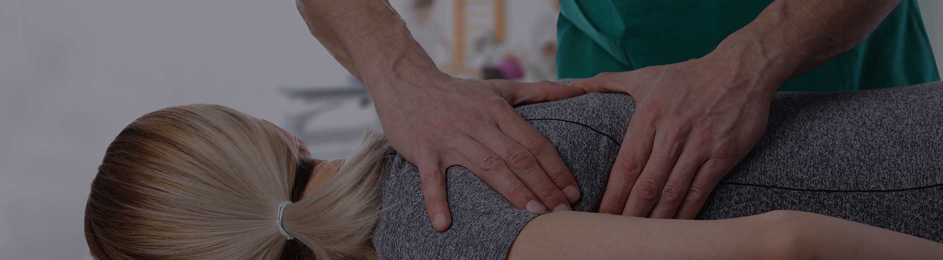 Woman having chiropractic back adjustment.