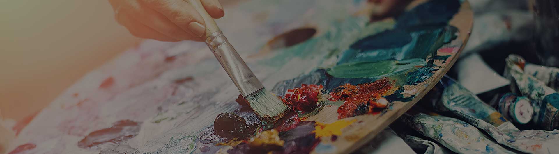 Artist using a paint palette.