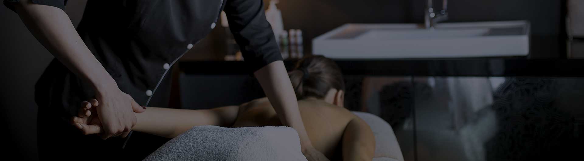 Massage therapist with a client.