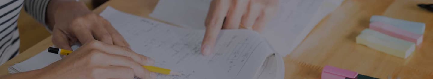 Tutor with student reviewing a assignment. Tutor with student reviewing a assignment.