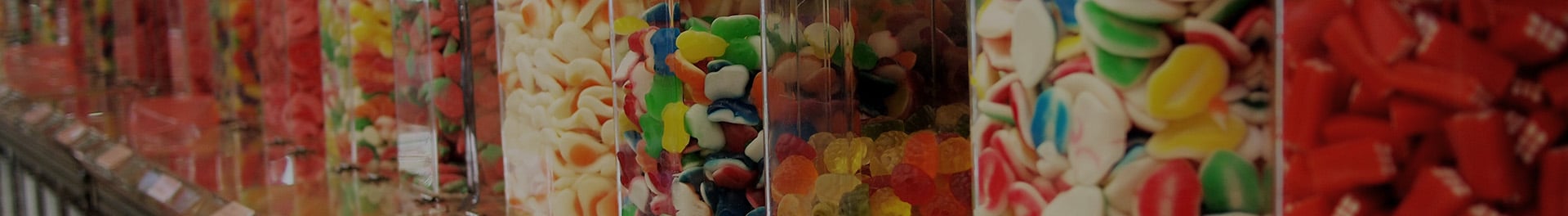 Jars filled with colorful candies.
