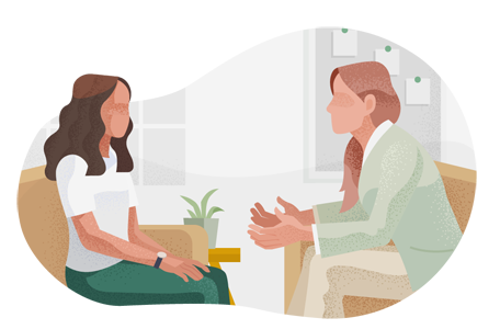 Occupational therapist speaking with female client.