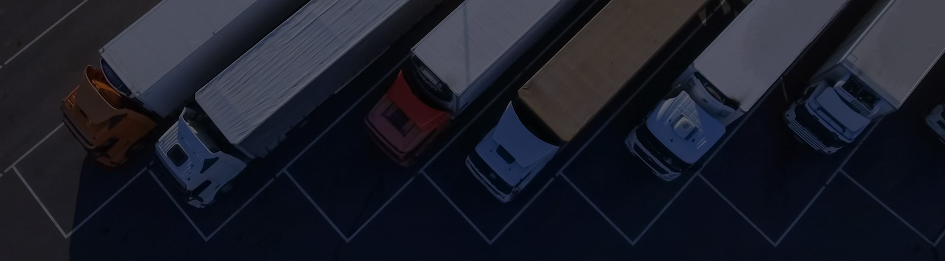 Aerial view of trucks in a parking lot.