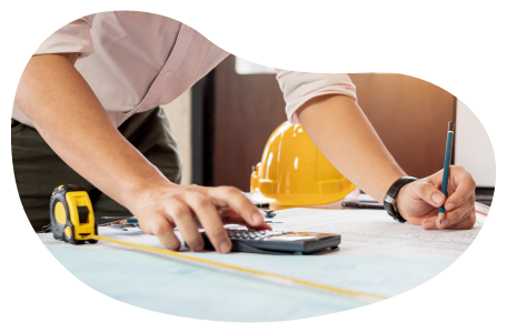 A contractor calculating measurements for a construction assignment A contractor calculating measurements for a construction assignment
