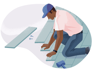 Construction worker installing flooring.