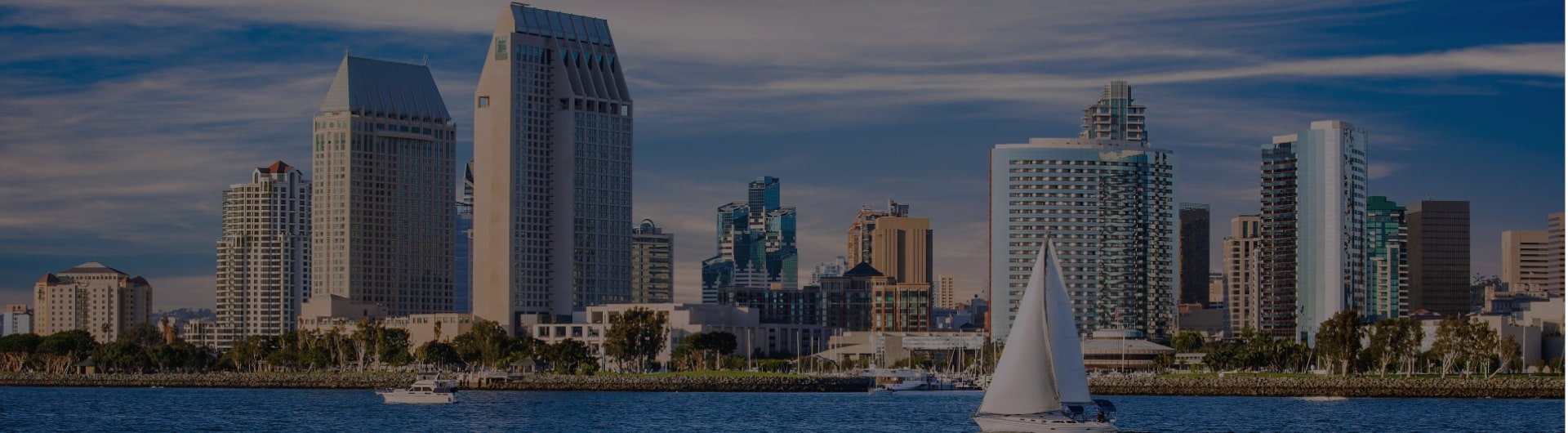 The San Diego skyline and a sailboat.