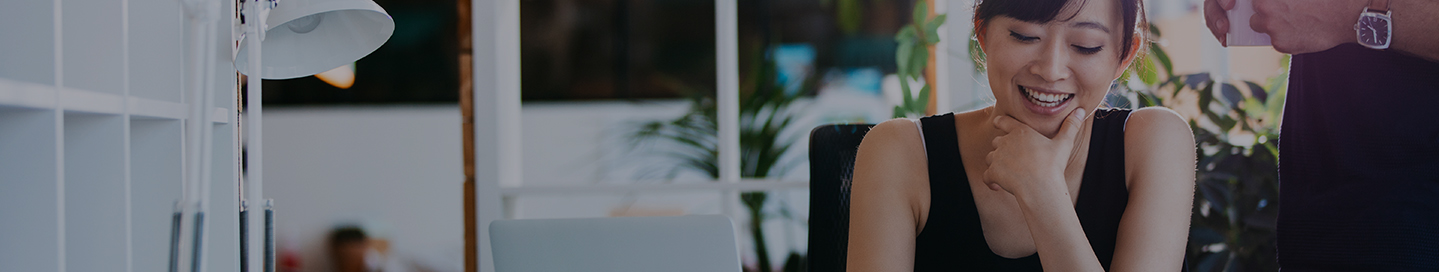 An AmTrust employee working on coverage for a small business customer.
