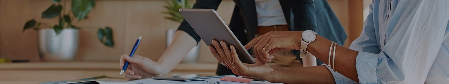 A Travelers insurance agent working with a small business owner. A Travelers insurance agent working with a small business owner.