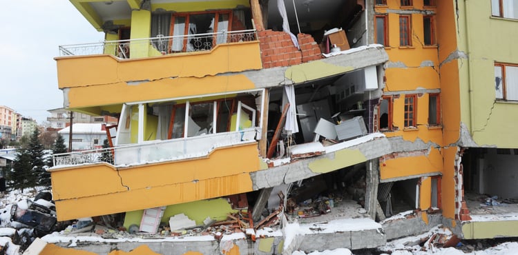 Building collapsing after earthquake hits.