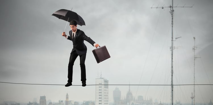 Man balancing on a tightrope with an umbrella and a briefcase. Man balancing on a tightrope with an umbrella and a briefcase.