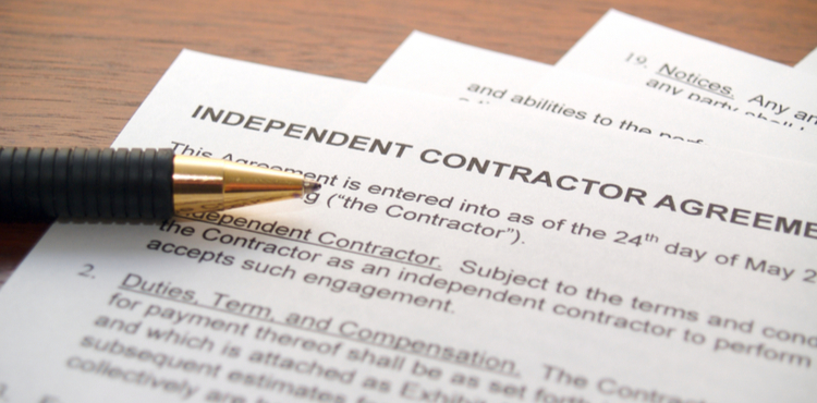 An independent contractor agreement and pen.