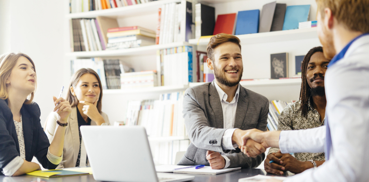 Man shaking hands with client.