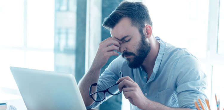 Frustrated man with a laptop