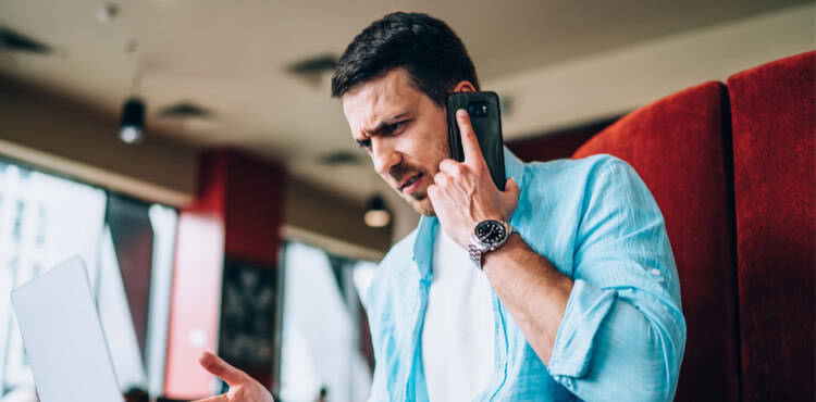Serious man talking on phone Serious man talking on phone
