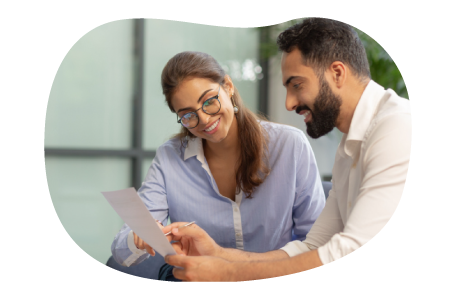 Two people comparing insurance quotes Two people comparing insurance quotes