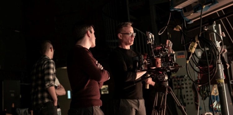 A videographer reviews a scene that was just shot A videographer reviews a scene that was just shot