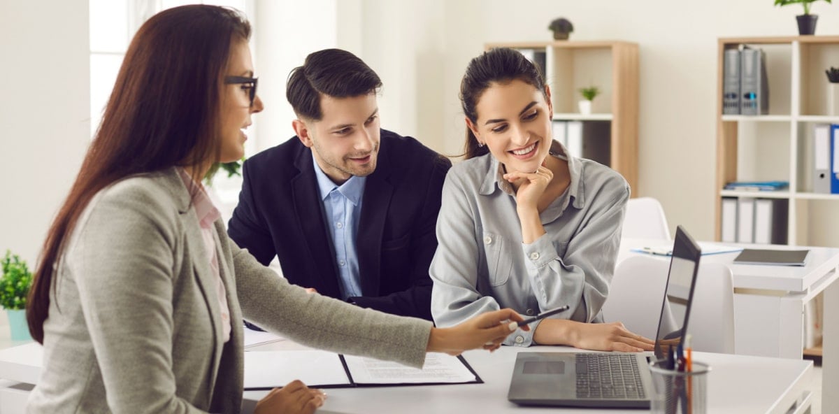 Insurance agent talking with potential clients