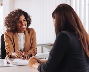 A small business owner meeting with a prospective new client.