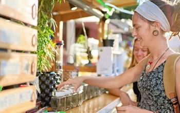 Woman browsing a cannabis dispensary's marijuana products