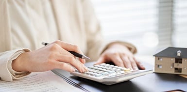 A small business owner calculating their loan payments
