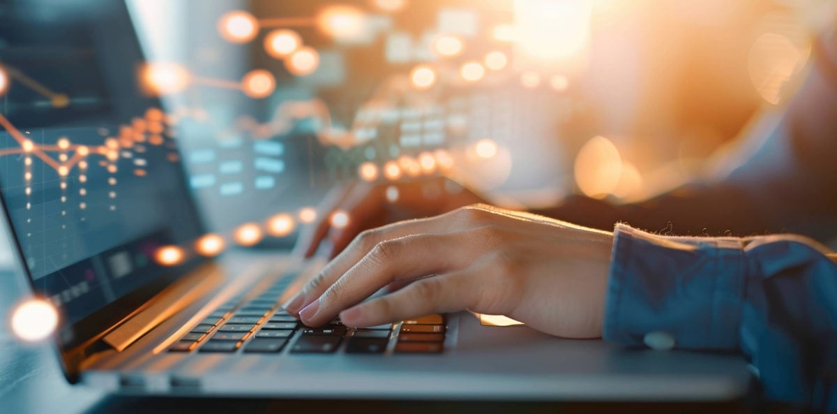 A small business owner looking up different insurance policies on their laptop A small business owner looking up different insurance policies on their laptop