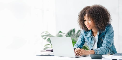 Person reviewing self-employed deductions on a laptop.