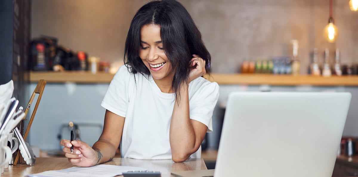 Small business owner working on a laptop. Small business owner working on a laptop.