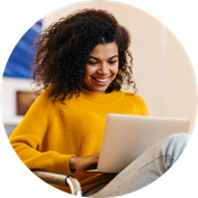 Person in a yellow shirt working on a laptop. Person in a yellow shirt working on a laptop.