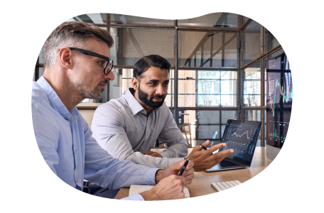 Stock brokers reviewing latest market trends. Stock brokers reviewing latest market trends.