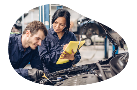 Auto mechanic repairing a car engine.