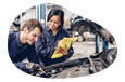 Auto mechanic repairing a car engine.