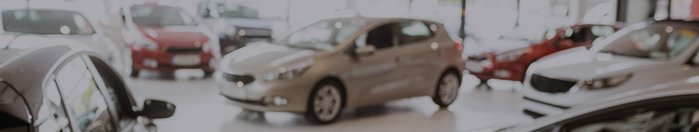 Cars in the showroom at a dealership.