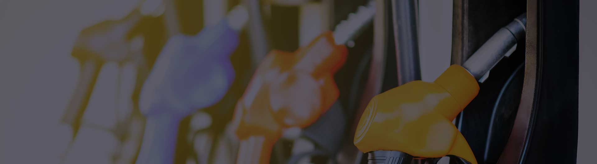 Colorful gas pump filling nozzles isolated on white background.