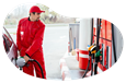 Gas station attendant fueling a car.