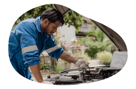 Mobile mechanic inspecting a client's engine. Mobile mechanic inspecting a client's engine.