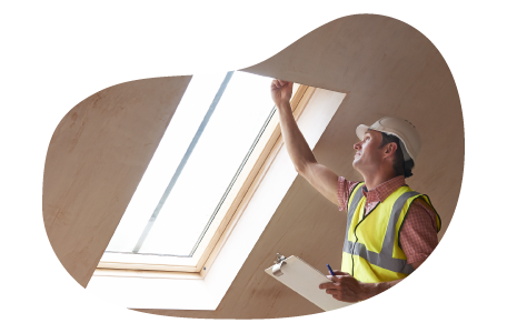 Building inspector looking at the structure of a window frame.