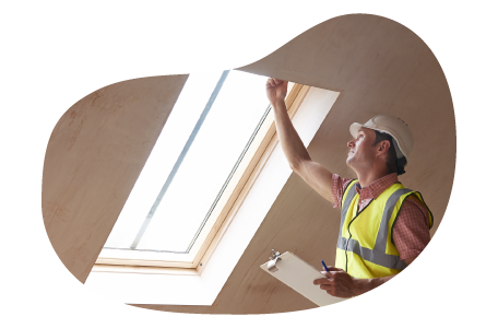 Building inspector looking at the structure of a window frame. Building inspector looking at the structure of a window frame.