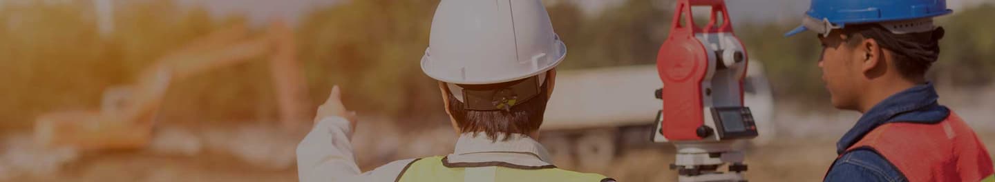 Land surveyor at a job site.