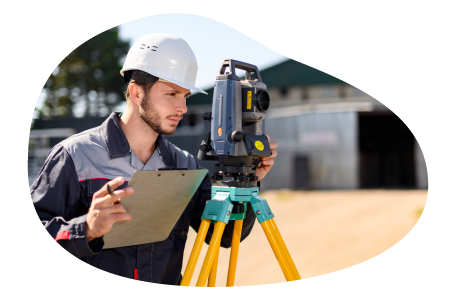 Land surveyor observing a plot of land.