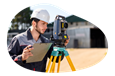 Land surveyor observing a plot of land.