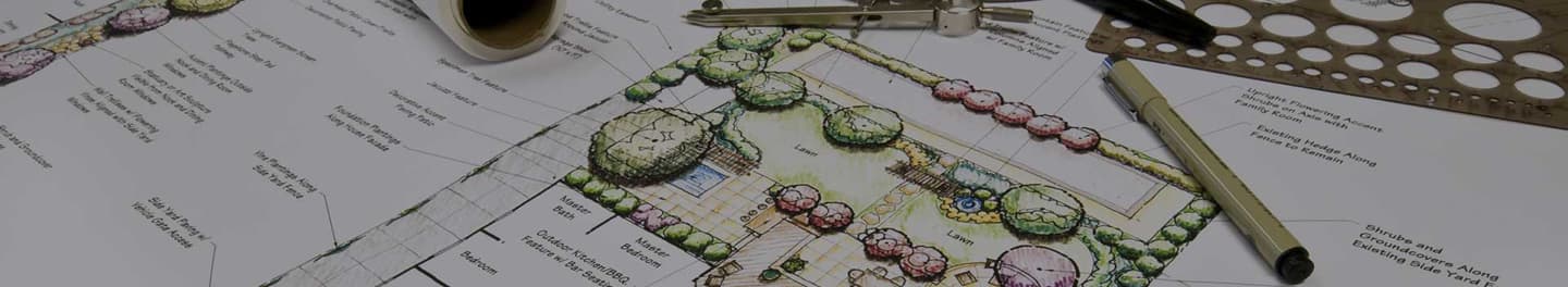 Desk with large landscape design plan. Desk with large landscape design plan.