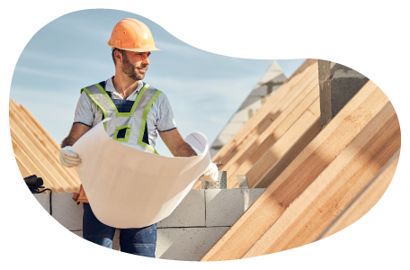 Project manager reviewing the plans for a new building structure.