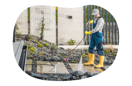 Pressure washer cleaning a client walkway.