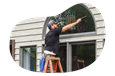 Window cleaner wiping a client's window.