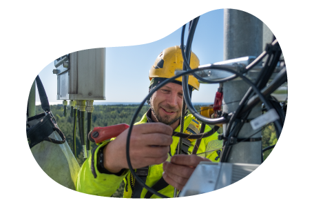 A cell tower technician performs routine maintenance.