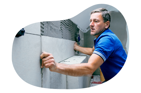 Contractor installing a new wall for a home renovation.