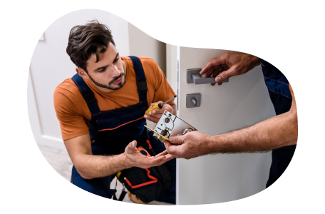 Locksmith displaying a padlock to a client.