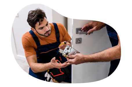 Locksmith displaying a padlock to a client. Locksmith displaying a padlock to a client.