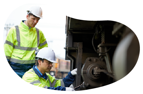 Railroad contractors working on a train. Railroad contractors working on a train.