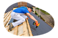 Roofing contractor applying tile to the roof of a house.